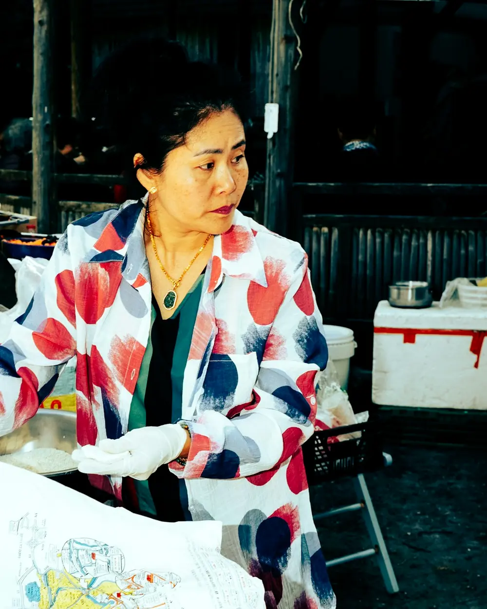 A trader at a market stall