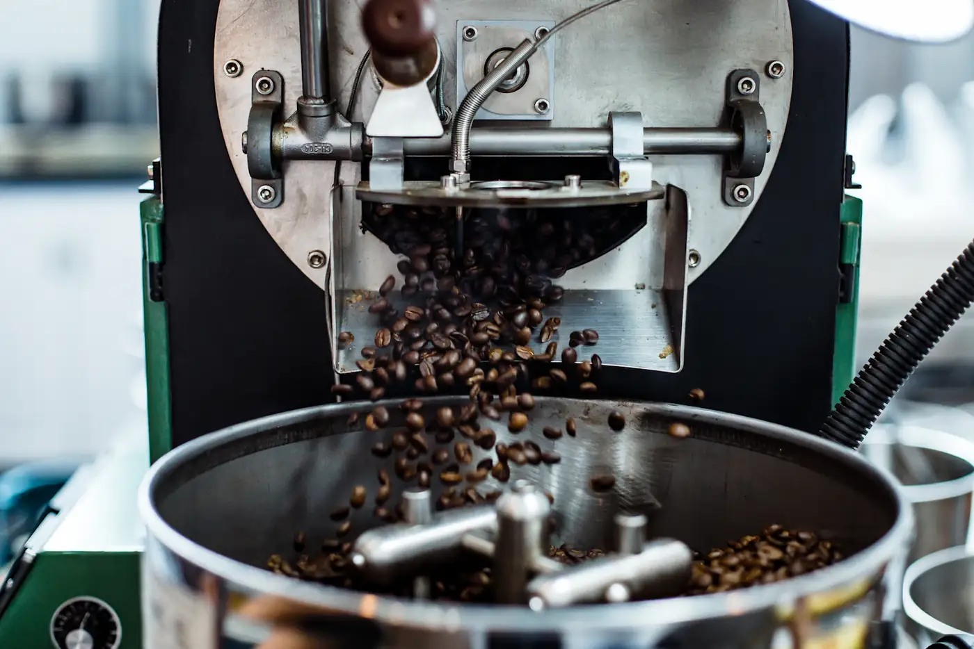 Beans falling from the roaster chute