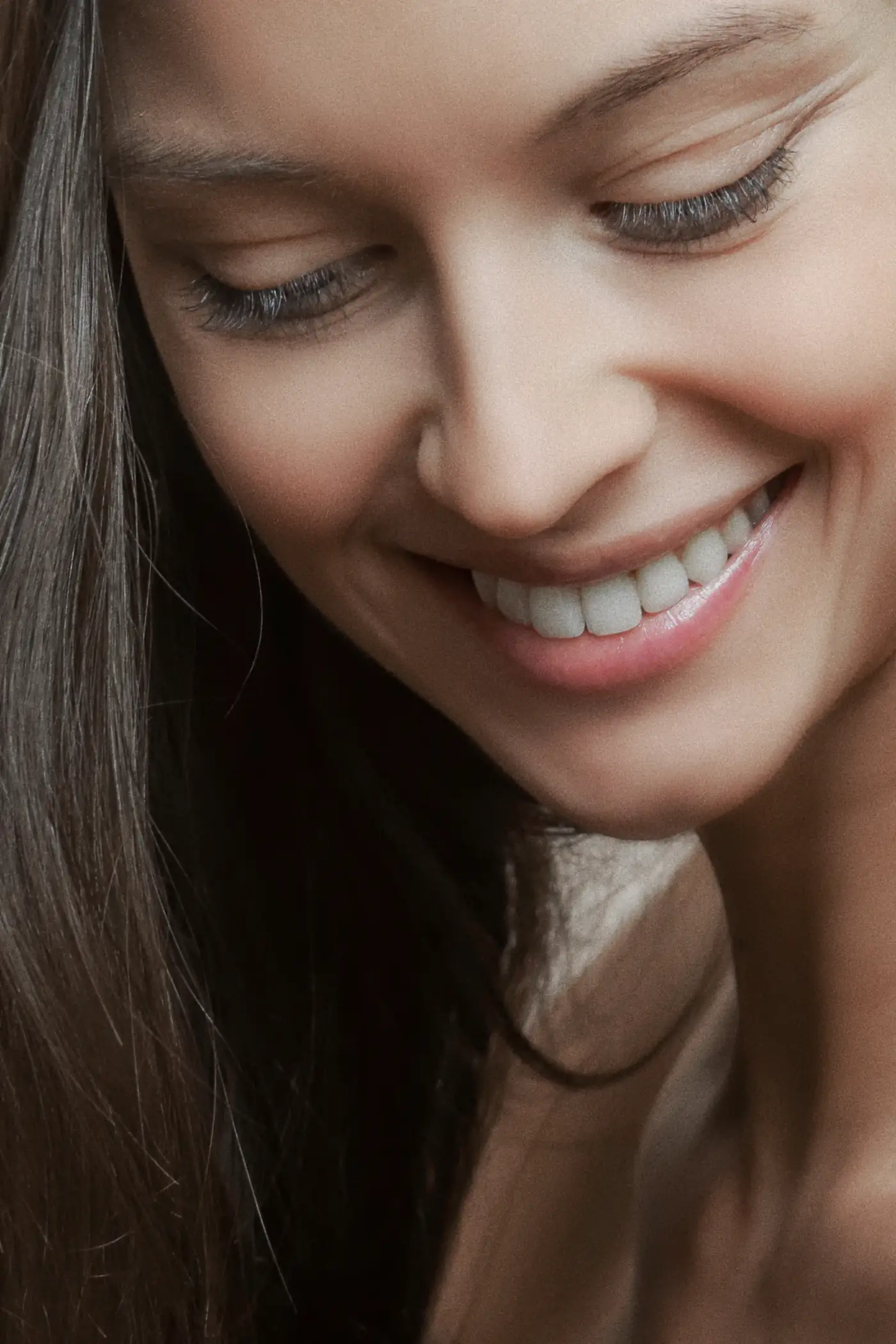 Woman smiling and looking down