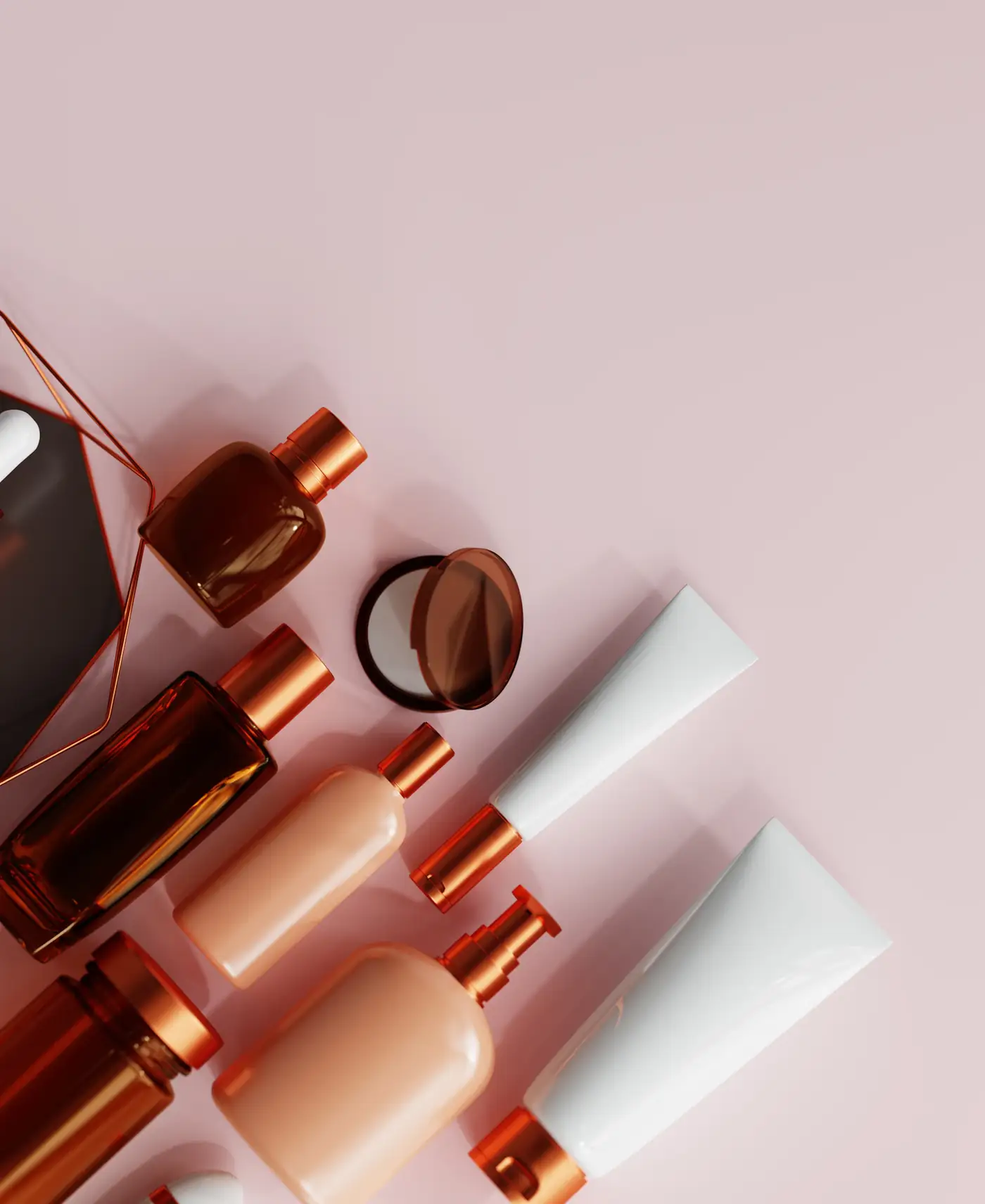 Bottles with copper caps on pink