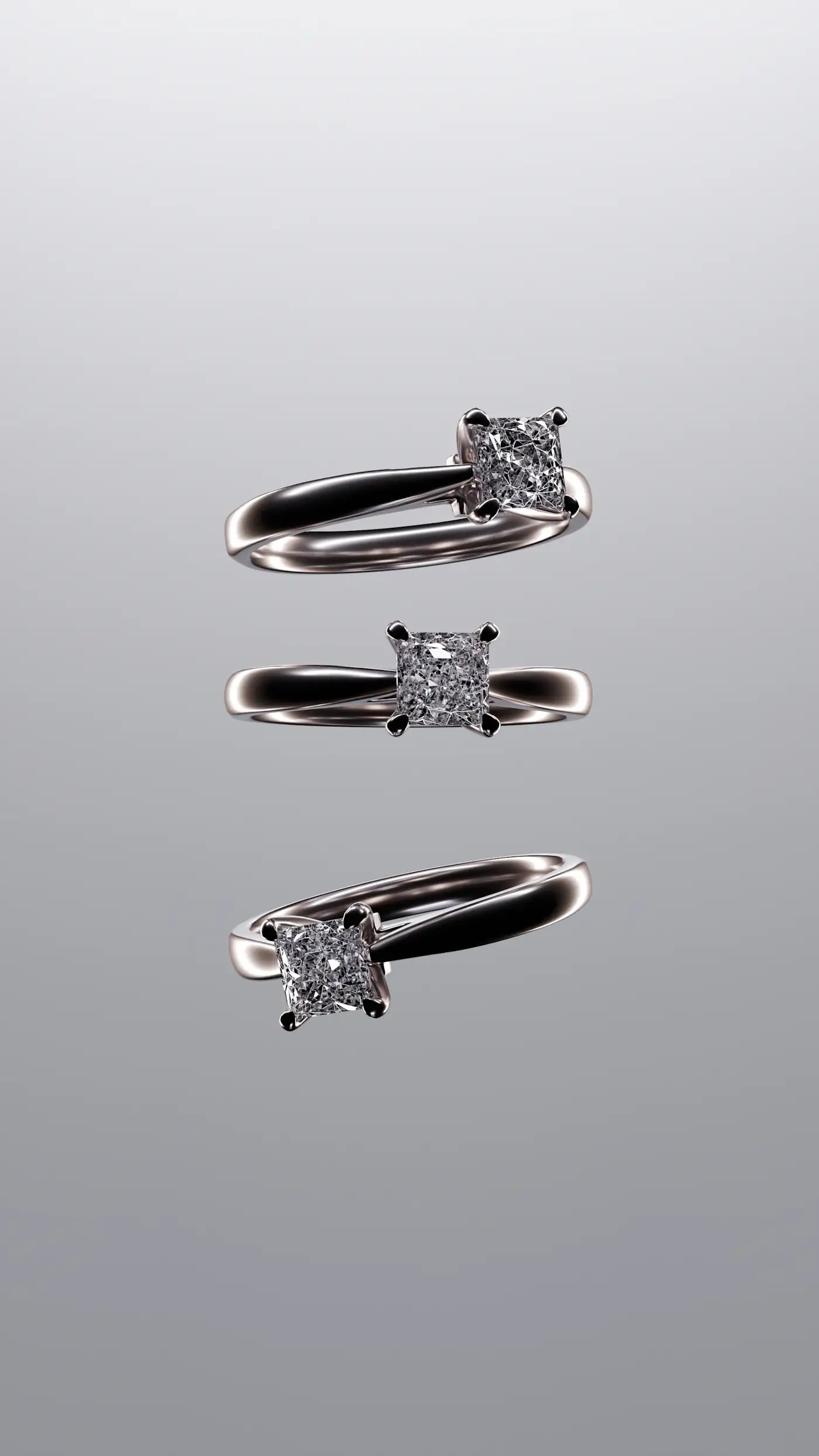 Three solitaire diamond rings floating against a soft grey background