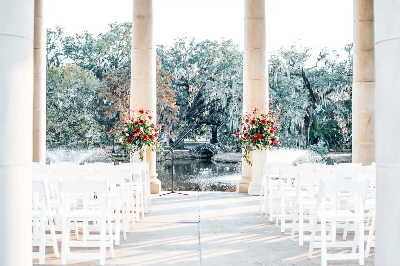 Ceremony with white columns and chairs