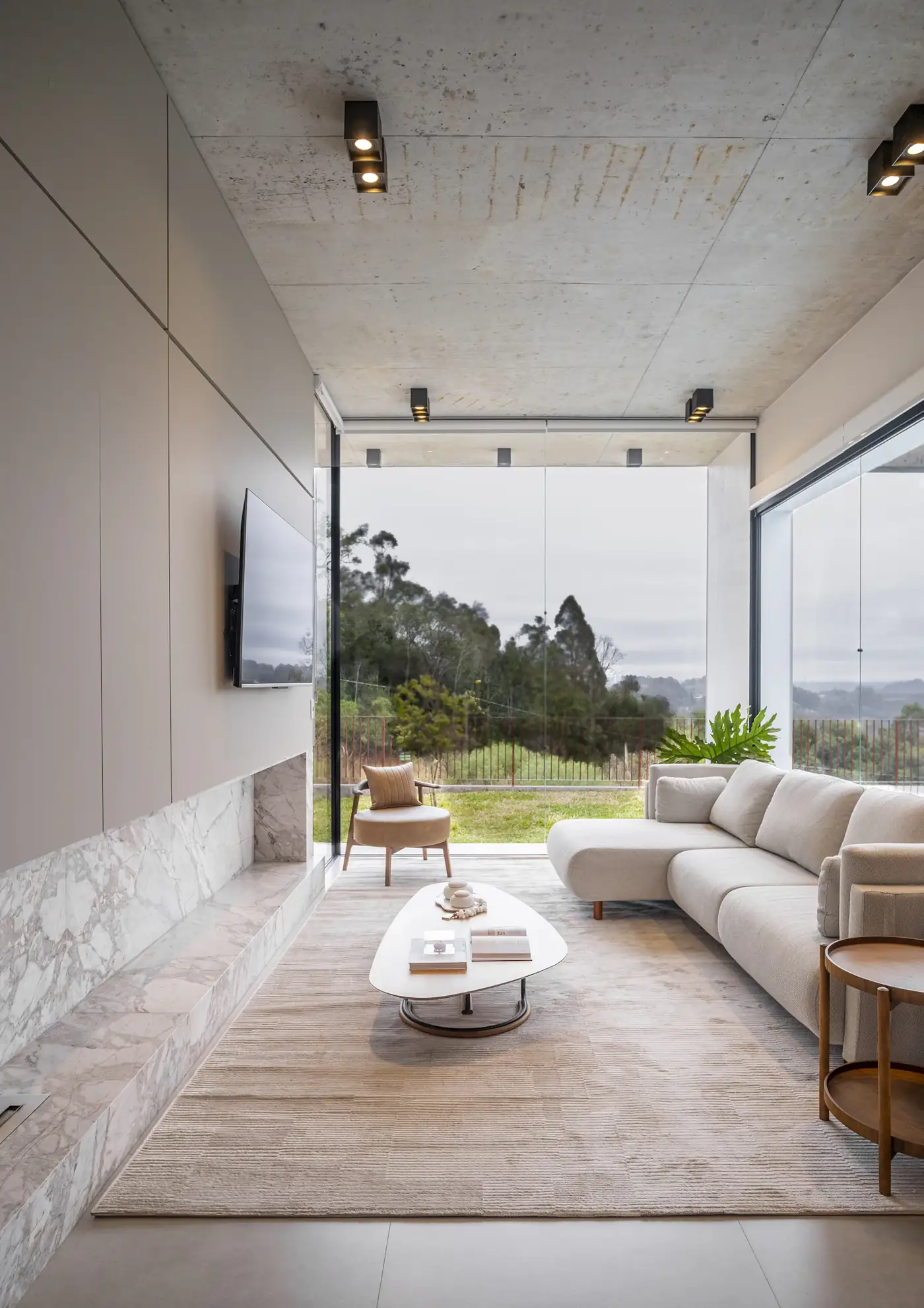 Bright living room with a glass wall onto the garden