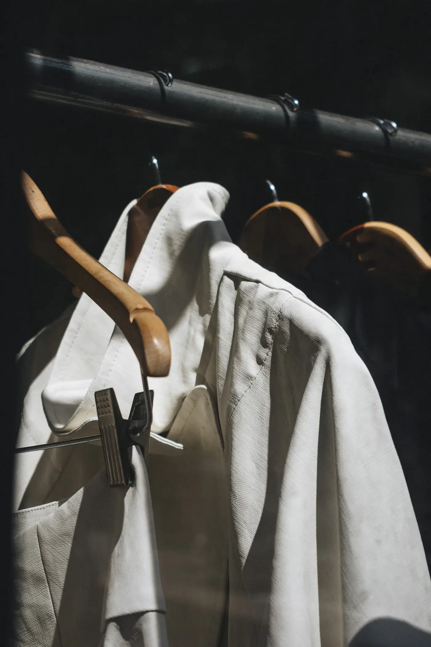 Cream coat on wooden hangers