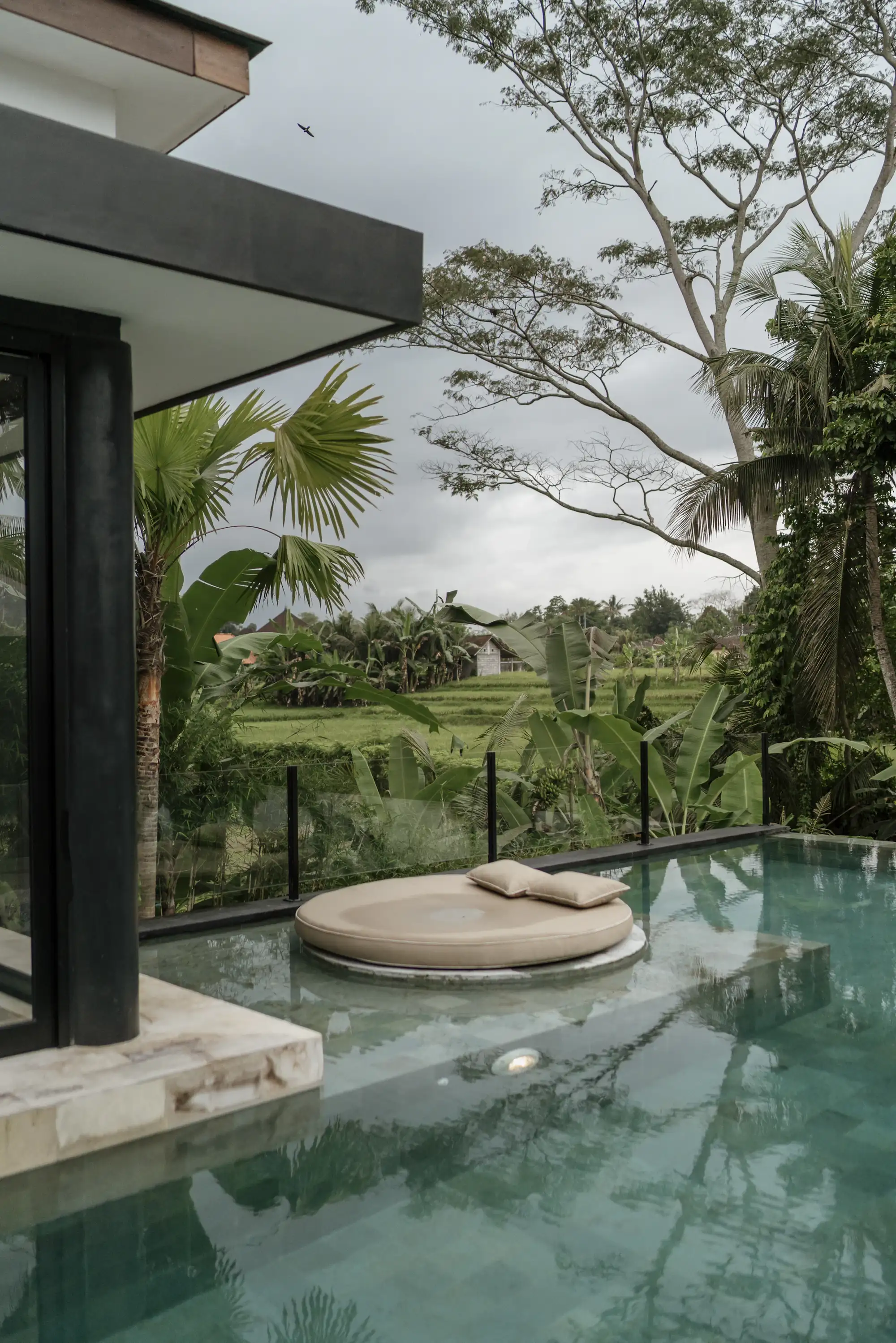 Pool deck facing rice fields